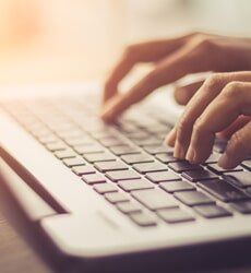 Auto glass technician working on a vehicle windshield